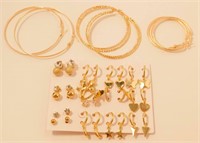 15 New Pairs Of Gold Tone Hoop Style Earrings.