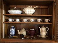 CONTENTS OF CABINET- TEA POTS, DISHES, CUPS AND