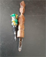 An opener wood handle an a wine stopper