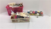 Assorted craft supplies. Paints and baskets of