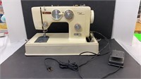 Vintage BayCrest sewing machine with cover.