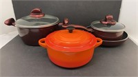 Three pots and one pan. Two TFal pots and pan,