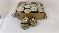 Box of 11 pint style jars with lids and extra