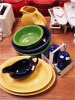 Eight Fiestaware serving pieces: pitcher, bowl,
