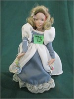 Doll on stand