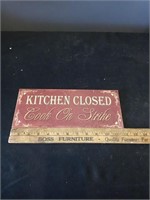 Kitchen closed cook on strike sign