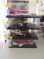 4 DIE CAST HOLIDAY CARS IN DISPLAY CASES