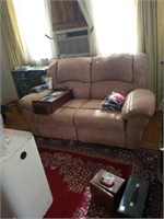 Suede loveseat with recliners on ends. In good