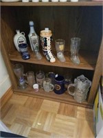 Group of beer mugs and bottles. Contents of 2