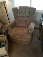 BROWN UPHOLSTERIED ROCKING CHAIR