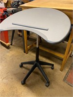Adjustable rolling drafting table