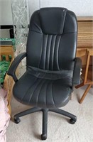 Black office chair worn arm