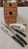 3 Cutco knives, knife sharpener, and knife block