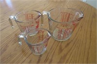 Three Fireking measuring cups