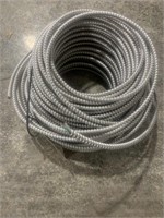Metal conduit with wire inside