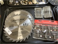 Craftsman saw blades, router bits, tap set.