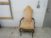 Tall back armed vintage chair.