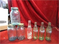 Vintage blue ball jars and coca cola bottles.