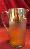 Vintage Carnival glass. Textured pitcher.