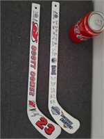 2 mini hockey sticks