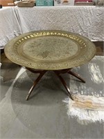 Brass top table on base