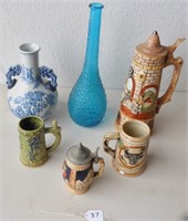 6 items either steins or vases