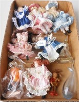 Box of small porecelain dolls & some  glassware