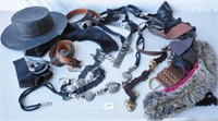 Several belts, a black hat and 2 fur pieces