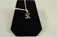 14K YELLOW GOLD "R" PENDANT .5G TOTAL WEIGHT