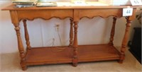 Tell City maple sofa table with scalloped trim,