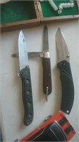 Group of three folding knives one is Kershaw