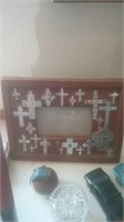 Picture frame covered in crosses