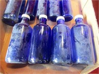 (9) Vintage blue glass bottles w/lids.