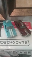 Diecast Camaro and Ford Mustang red with silver