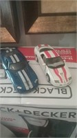 Die-cast Dodge Viper and white camaro with o