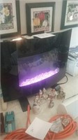 Electric heater fireplace changes color and has