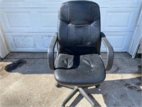Leather office chair on wheels
