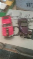 Diecast red Mustang and purple Prowler
