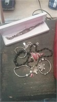 Group of costume jewelry including a vintage ID