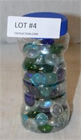 BOTTLE OF DECORATIVE GLASS ROCKS