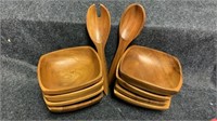 Set of 8 wooden bowls with serving spoon.
