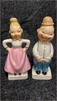 Vintage salt and pepper shakers. One side is