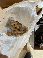Two boxes of wine bottles and wine corks
