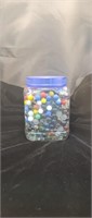 Large container of marbles 
Some uranium