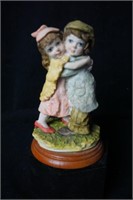 Boy and Girl Hugging Figurine