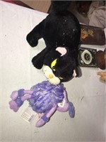 Stuff cat and purple doll