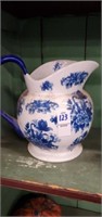 Blue floral pitcher  8 in tall