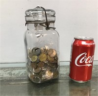 Coin collection in a jar