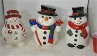 Three snow men cookie jars one has damage on