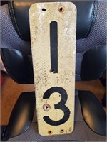 Vintage 13 sign with bullet holes